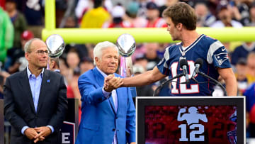 Sep 10, 2023; Foxborough, Massachusetts, USA; New England Patriots former quarterback Tom Brady shakes hands with New England Patriots owner Robert Kraft during a halftime ceremony in his honor during the game between the Philadelphia Eagles and New England Patriots at Gillette Stadium. Mandatory Credit: Eric Canha-USA TODAY Sports