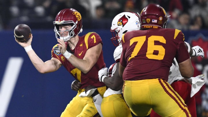 Dec 27, 2023; San Diego, CA, USA; USC Trojans quarterback Miller Moss (7) throws a pass during the second half against the Louisville Cardinals at Petco Park. Mandatory Credit: Orlando Ramirez-USA TODAY Sports