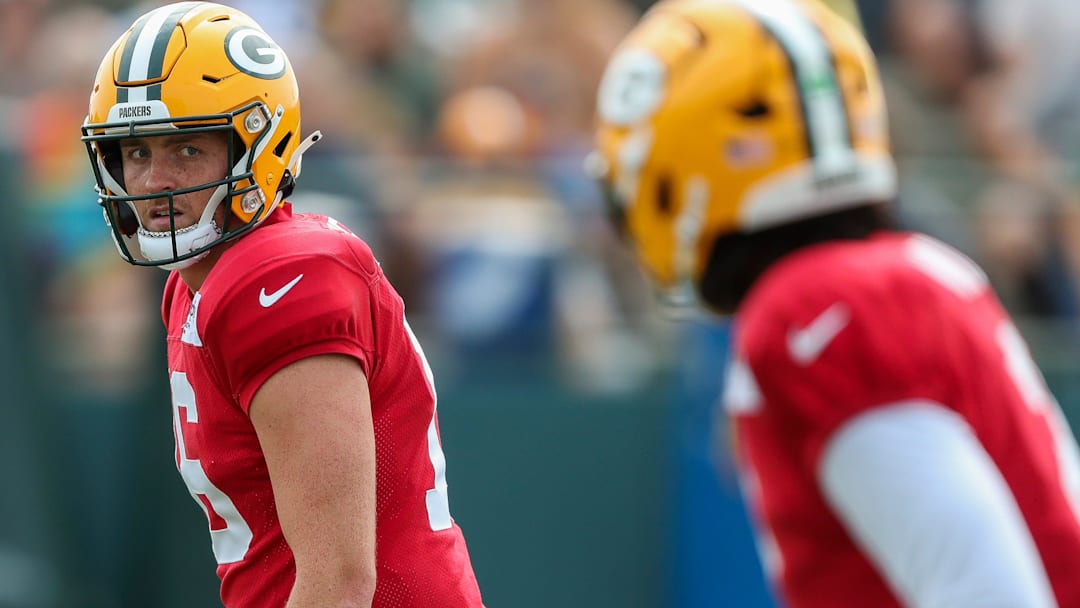 Green Bay Packers quarterback Sean Clifford (16) looks over to Malik Willis (2) in a drill during practice on Tuesday, August 12, 2025, at Ray Nitschke Field in Ashwaubenon, Wis.