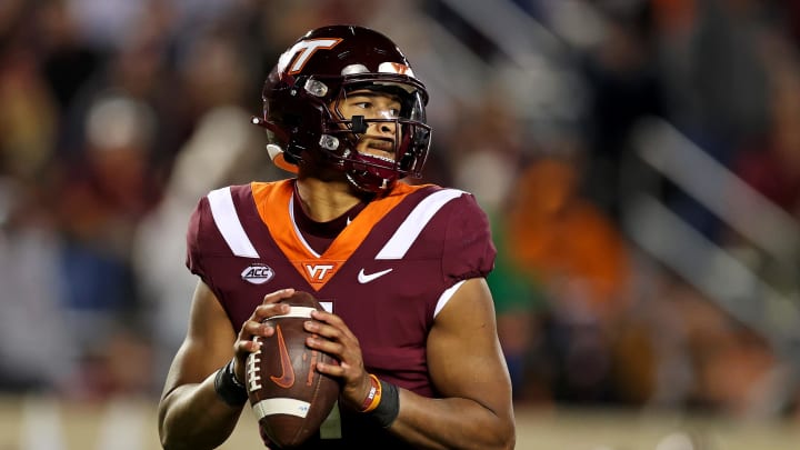 Nov 18, 2023; Blacksburg, Virginia, USA; Virginia Tech Hokies quarterback Kyron Drones (1) throws a pass against the North Carolina State Wolfpack at Lane Stadium. Mandatory Credit: Peter Casey-USA TODAY Sports