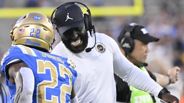 Oct 12, 2024; Pasadena, California, USA; UCLA Bruins running back Keegan Jones (22) celebrates with head coach DeShaun Foster after scoring a touchdown against the Minnesota Golden Gophers during the first quarter at Rose Bowl. Mandatory Credit: Robert Hanashiro-Imagn Images Oct 12, 2024; Pasadena, California, USA; UCLA Bruins running back Keegan Jones (22) celebrates with head coach DeShaun Foster after scoring a touchdown against the Minnesota Golden Gophers during the first quarter at Rose Bowl. Mandatory Credit: Robert Hanashiro-Imagn Images