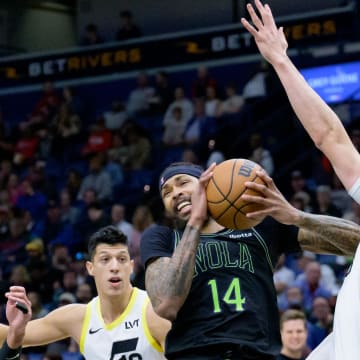 Jan 23, 2024; New Orleans, Louisiana, USA; New Orleans Pelicans forward Brandon Ingram (14) runs into Utah Jazz forward Lauri Markkanen (23) during the first quarter at Smoothie King Center. Mandatory Credit: Matthew Hinton-USA TODAY Sports