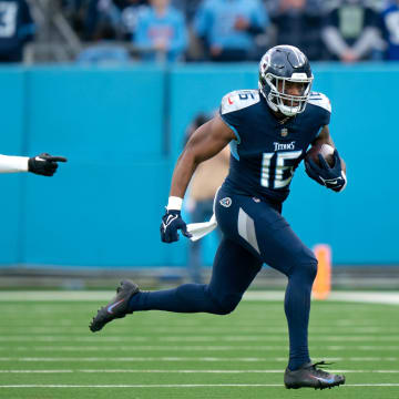 Tennessee Titans wide receiver Treylon Burks (16) runs after the catch as Seattle Seahawks safety Jamal Adams (33) pursues late in the fourth quarter of their game at Nissan Stadium in Nashville, Tenn., Sunday, Dec. 24, 2023.