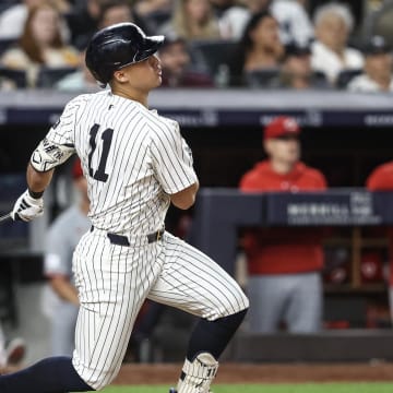 Jul 3, 2024; Bronx, New York, USA; New York Yankees shortstop Anthony Volpe (11) hits a two run double in the seventh inning against the Cincinnati Reds at Yankee Stadium.
