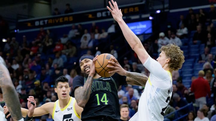 Jan 23, 2024; New Orleans, Louisiana, USA; New Orleans Pelicans forward Brandon Ingram (14) runs into Utah Jazz forward Lauri Markkanen (23) during the first quarter at Smoothie King Center. Mandatory Credit: Matthew Hinton-USA TODAY Sports