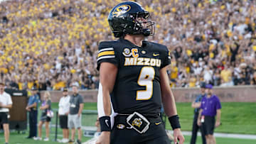 Aug 28, 2025; Columbia, Missouri, USA; Missouri Tigers quarterback Beau Pribula (9) celebrates after scoring against the Central Arkansas Bears during the first half of the game at Faurot Field at Memorial Stadium. Mandatory Credit: Denny Medley-Imagn Images