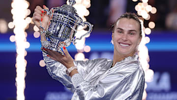 Aryna Sabalenka holds aloft the U.S. Open trophy after the tournament final.