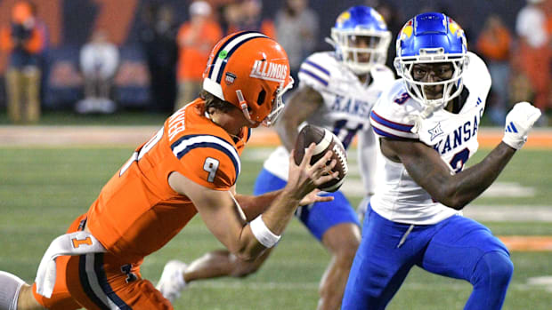 Kansas Jayhawks cornerback Mello Dotson (3) pursues Illinois Fighting Illini quarterback Luke Altmyer (9) during the second h