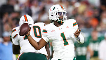 Sep 21, 2024; Tampa, Florida, USA; Miami Hurricanes quarterback Cam Ward (1) throws a pass against the South Florida Bulls in the third quarter at Raymond James Stadium. Mandatory Credit: Nathan Ray Seebeck-Imagn Images
