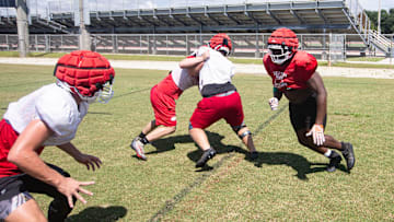James Johnson, right, a defensive lineman for the North Fort Myers High School football team practices with teammates on Tuesday, Sept. 17, 2024.