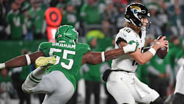 Nov 3, 2024; Philadelphia, Pennsylvania, USA;  Jacksonville Jaguars quarterback Trevor Lawrence (16) is pressured by Philadelphia Eagles defensive end Brandon Graham (55) during the fourth quarter at Lincoln Financial Field. Mandatory Credit: Eric Hartline-Imagn Images