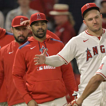 Jun 28, 2025; Anaheim, California, USA;  Los Angeles Angels right fielder Mike Trout (27) greets right fielder Gustavo Campero (51) after the final out of the ninth inning defeating the Washington Nationals at Angel Stadium. Mandatory Credit: Jayne Kamin-Oncea-Imagn Images