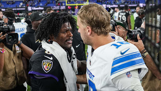 Jared Goff and Lamar Jackson greet each other after a game