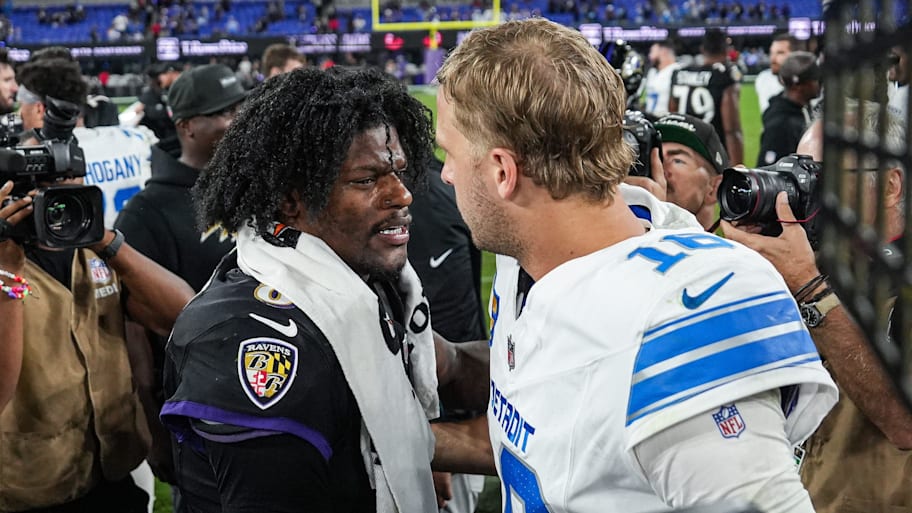 Jared Goff and Lamar Jackson greet each other after a game