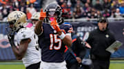  Bears wide receiver and former Husky Rome Odunze (15) signals a first down against New Orleans.