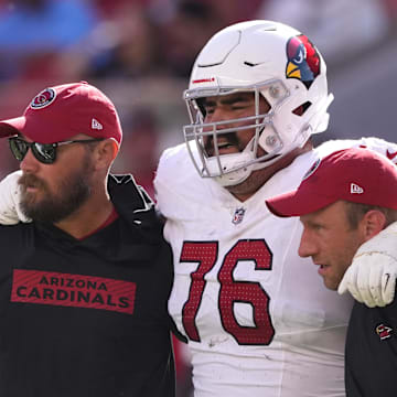 Oct 6, 2024; Santa Clara, California, USA; Arizona Cardinals guard Will Hernandez (76) is helped off of the field by medical personnel after suffering an injury during the fourth quarter against the San Francisco 49ers at Levi's Stadium. Mandatory Credit: Darren Yamashita-Imagn Images