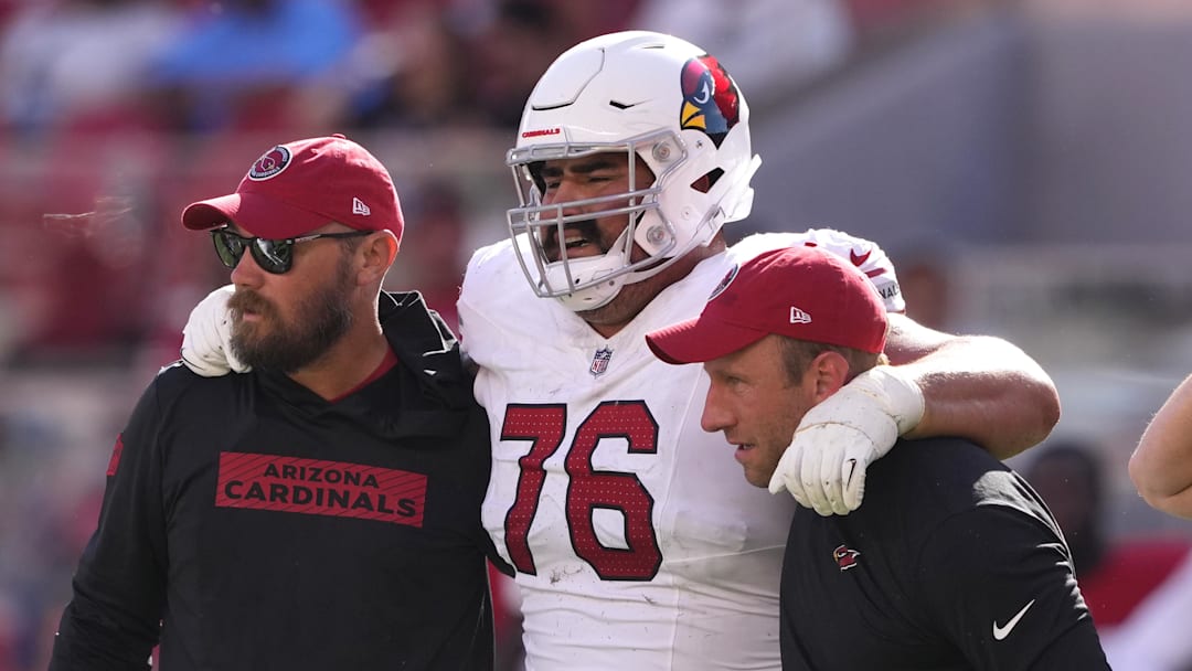 Oct 6, 2024; Santa Clara, California, USA; Arizona Cardinals guard Will Hernandez (76) is helped off of the field by medical personnel after suffering an injury during the fourth quarter against the San Francisco 49ers at Levi's Stadium. Mandatory Credit: Darren Yamashita-Imagn Images