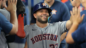 Aug 4, 2025; Miami, Florida, USA; Houston Astros second baseman Jose Altuve (27) celebrates after scoring against the Miami Marlins during the fourth inning at loanDepot Park. Mandatory Credit: Sam Navarro-Imagn Images