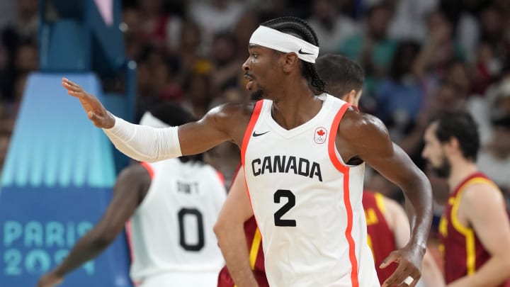 Aug 2, 2024; Villeneuve-d'Ascq, France; Canada guard Shai Gilgeous-Alexander (2) celebrates after scoring a three point shot against Spain in the first half in a men’s group A basketball game during the Paris 2024 Olympic Summer Games at Stade Pierre-Mauroy. Mandatory Credit: John David Mercer-USA TODAY Sports