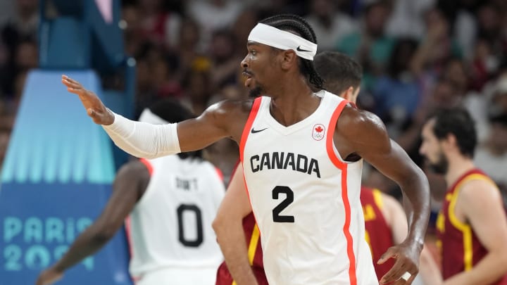 Aug 2, 2024; Villeneuve-d'Ascq, France; Canada guard Shai Gilgeous-Alexander (2) celebrates after scoring a three point shot against Spain in the first half in a men’s group A basketball game during the Paris 2024 Olympic Summer Games at Stade Pierre-Mauroy. Mandatory Credit: John David Mercer-USA TODAY Sports