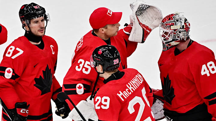 [US, Mexico & Canada customers only] Feb 13, 2026; Milan, Italy; Nathan MacKinnon, Sidney Crosby, Darcy Kuemper and Logan Thompson of Canada celebrate after the match against Switzerland in men's ice hockey group A play during the Milano Cortina 2026 Olympic Winter Games at Milano Santagiulia Ice Hockey Arena. Mandatory Credit: Marton Monus/Reuters via Imagn Images