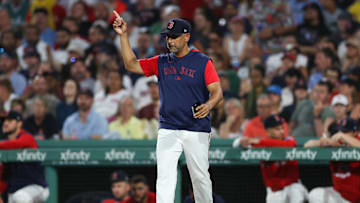 Jul 2, 2025; Boston, Massachusetts, USA; Boston Red Sox manager Alex Cora (13) makes a pitching change during the seventh inning against the Cincinnati Reds at Fenway Park. Mandatory Credit: Paul Rutherford-Imagn Images