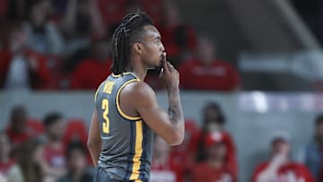 Dec 13, 2022; Houston, Texas, USA; North Carolina A&T Aggies guard Kam Woods (3) reacts after scoring a basket during the first half against the Houston Cougars at Fertitta Center. Mandatory Credit: Troy Taormina-Imagn Images