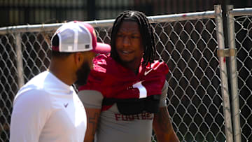 FSU football players walk into the first spring practice of the spring season on Wednesday, March 19, 2025