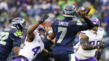 Dec 22, 2024; Seattle, Washington, USA; Minnesota Vikings safety Josh Metellus (44) pressures Seattle Seahawks quarterback Geno Smith (7) to throw an interception during the second quarter at Lumen Field. Mandatory Credit: Joe Nicholson-Imagn Images