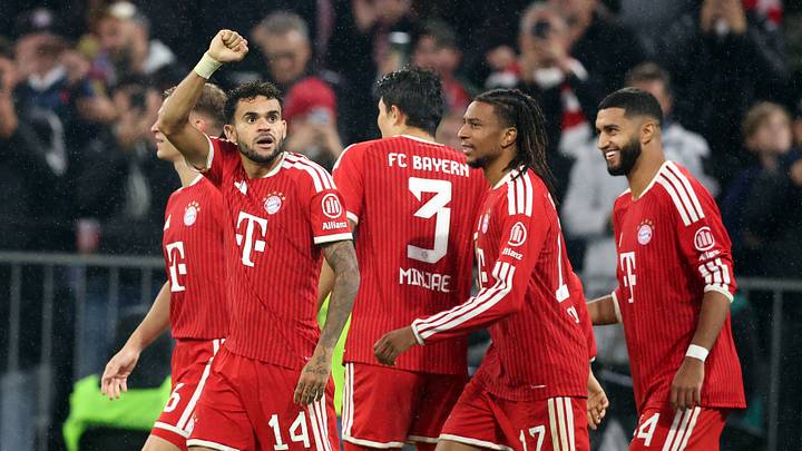 Bayern Munich players celebrating after scoring a goal against RB Leipzig.