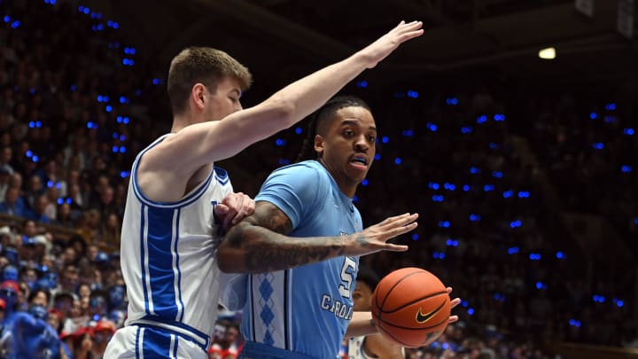 Mar 9, 2024; Durham, North Carolina, USA; North Carolina Tar Heels forward Armando Bacot (5) drives to the basket as Duke Blue Devils center Kyle Filipowski (30) defends during the first half at Cameron Indoor Stadium. Mandatory Credit: Rob Kinnan-USA TODAY Sports