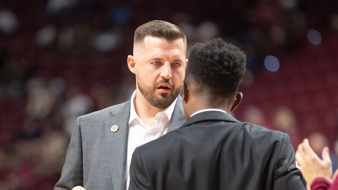 Florida State Seminoles head coach Luke Loucks prepares to huddle with his team during a timeout. The Florida State Seminoles lead the Alcorn State Braves 58-44 at the half on Tuesday, Nov. 4, 2025.