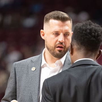 Florida State Seminoles head coach Luke Loucks prepares to huddle with his team during a timeout. The Florida State Seminoles lead the Alcorn State Braves 58-44 at the half on Tuesday, Nov. 4, 2025.