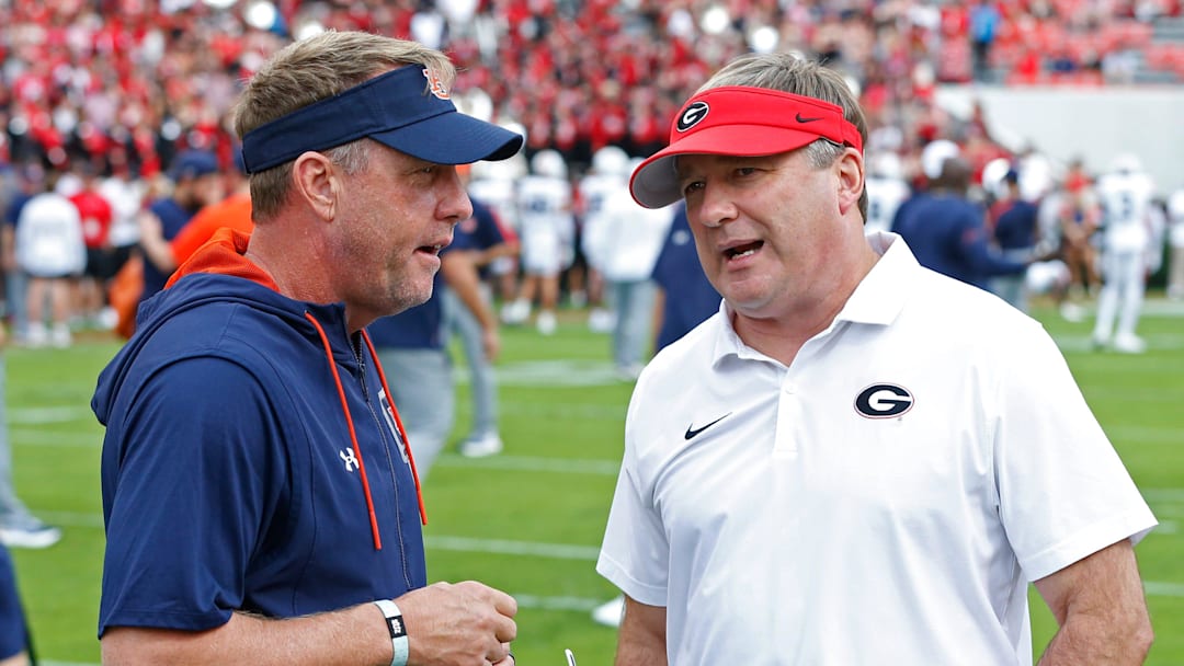 Hugh Freeze speaks with Kirby Smart before the Auburn / Georgia game last year. 