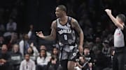 Apr 6, 2025; Brooklyn, New York, USA; Brooklyn Nets forward Dariq Whitehead (0) reacts to making a three point shot against the Toronto Raptors during the first half at Barclays Center. Mandatory Credit: Gregory Fisher-Imagn Images