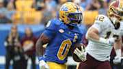 Sep 6, 2025; Pittsburgh, Pennsylvania, USA;  Pittsburgh Panthers running back Desmond Reid (0) runs after a catch against the Central Michigan Chippewas during the first quarter at Acrisure Stadium. Mandatory Credit: Charles LeClaire-Imagn Images