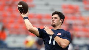 Sep 6, 2025; Auburn, Alabama, USA;  Auburn Tigers quarterback Jackson Arnold (11) warms up before the game against the Ball State Cardinals at Jordan-Hare Stadium. Mandatory Credit: John Reed-Imagn Images