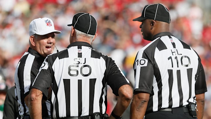 NFL referee Bill Vinovich talks with officials during a game between the Tampa Bay Buccaneers and Dallas Cowboys NFL referee Bill Vinovich talks with officials during a game between the Tampa Bay Buccaneers and Dallas Cowboys