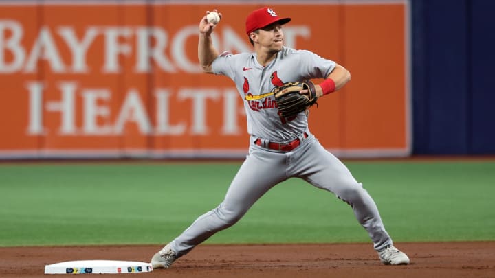 Aug 8, 2023; St. Petersburg, Florida, USA;  St. Louis Cardinals shortstop Tommy Edman (19) throws the ball to first base for a double play during the first inning against the Tampa Bay Rays at Tropicana Field. Mandatory Credit: Kim Klement Neitzel-USA TODAY Sports