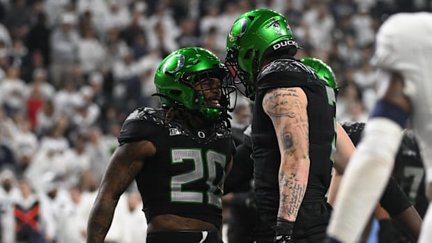 ; Oregon Ducks running back Jordan James (20) and tight end Terrance Ferguson (3) celebrate a touchdown during the second qua