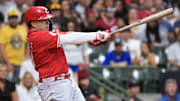 Sep 27, 2025; Milwaukee, Wisconsin, USA;  Cincinnati Reds first baseman Sal Stewart (43) hits an RBI single during the third inning against the Milwaukee Brewers at American Family Field. Mandatory Credit: Jeff Hanisch-Imagn Images