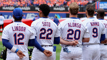 Apr 4, 2025; New York City, New York, USA; New York Mets shortstop Francisco Lindor (12) and right fielder Juan Soto (22) and first baseman Pete Alonso (20) and left fielder Brandon Nimmo (9) stand for the national anthem before the Mets home opener against the Toronto Blue Jays at Citi Field. Mandatory Credit: Brad Penner-Imagn Images