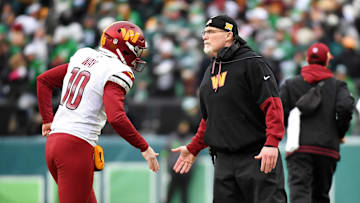 Jan 26, 2025; Philadelphia, PA, USA; Washington Commanders punter Tress Way (10) high fives head coach Dan Quinn during the first half in the NFC Championship game at Lincoln Financial Field. Mandatory Credit: Eric Hartline-Imagn Images