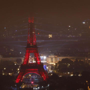 A view of the light and laser show at the Eiffel Tower during the Opening Ceremony for the Paris 2024 Olympic Summer Games as seen from the Montparnasse observation deck. 