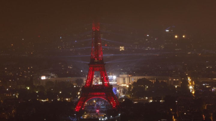 A view of the light and laser show at the Eiffel Tower during the Opening Ceremony for the Paris 2024 Olympic Summer Games as seen from the Montparnasse observation deck. 