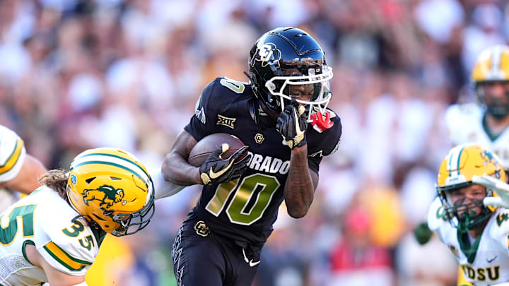 Aug 29, 2024; Boulder, Colorado, USA; Colorado Buffaloes wide receiver LaJohntay Wester (10) carries the ball in the first half against the North Dakota State Bison at Folsom Field. Mandatory Credit: Ron Chenoy-Imagn Images