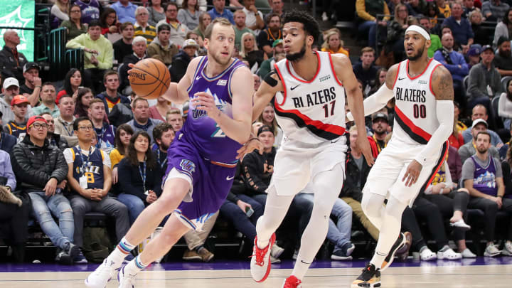 Dec 26, 2019; Salt Lake City, Utah, USA; Utah Jazz forward Joe Ingles (2) tries to dribble around Portland Trail Blazers forward Skal Labissiere (17) during the fourth quarter at Vivint Smart Home Arena. Utah Jazz won 121-115. Mandatory Credit: Chris Nicoll-USA TODAY Sports