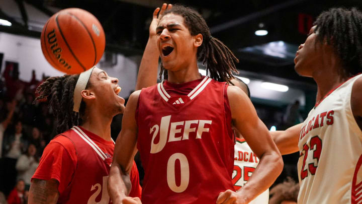 Jeffersonville Red Devils Tre Singleton (0) celebrates