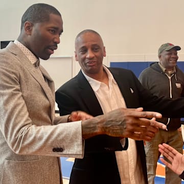 Former NBA guard Jamal Crawford, left, and his longtime high school coach in Mike Bethea, were part of blue-ribbon cutting ceremonies Saturday, introducing the new Rainier Beach HS gymnasium to the public.