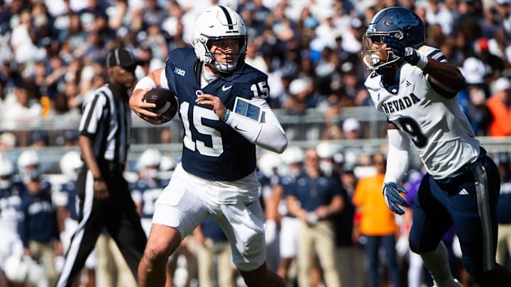 Penn State football quarterback Drew Allar runs with the ball in the first half against Nevada